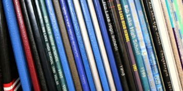 Picture of yearbook spines on shelf.